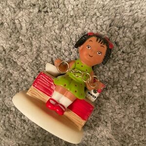 “five golden rings” holiday figurine kid with green dress & red accents